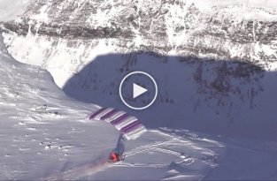 Невероятный прыжок на снегоходе с парапланом